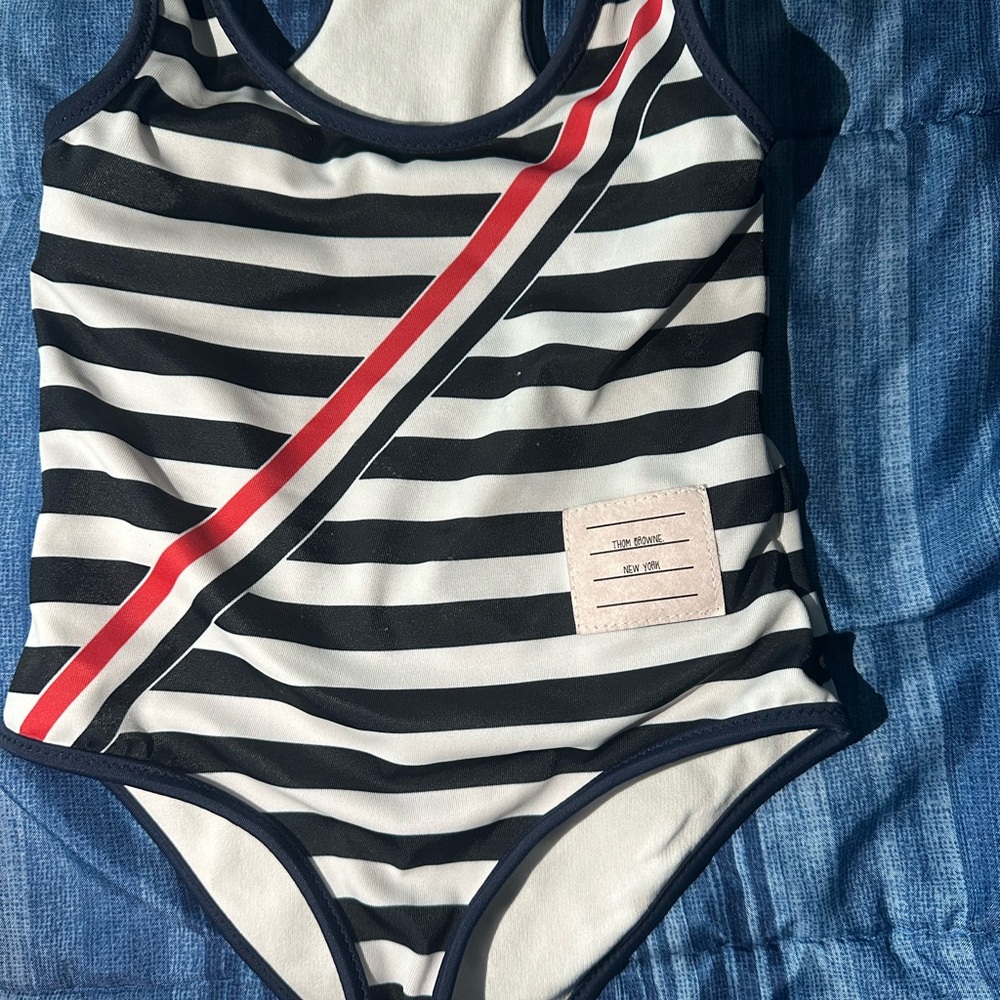 Striped Black and White Swimsuit with Red Accent